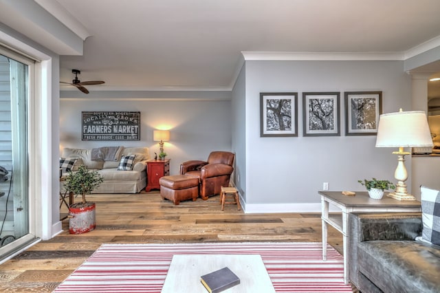 714 Popes Island Rd Unit 714, Milford, CT 06461 - living room featuring ornamental molding, wood finished floors, a ceiling fan, and baseboards