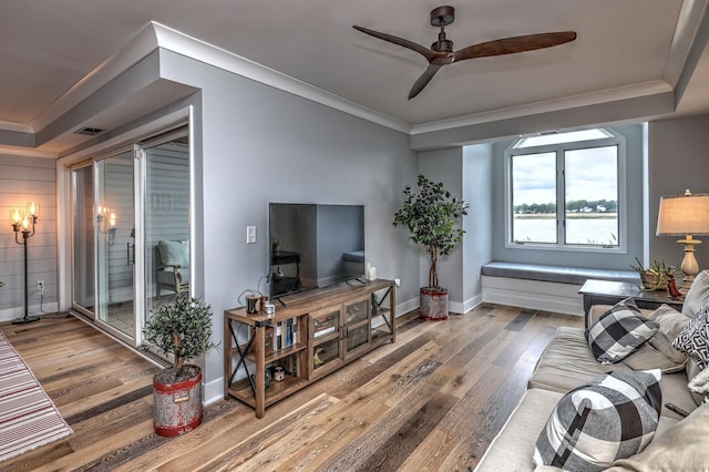 714 Popes Island Rd Unit 714, Milford, CT 06461 - living area with ornamental molding, wood finished floors, ceiling fan, and baseboards