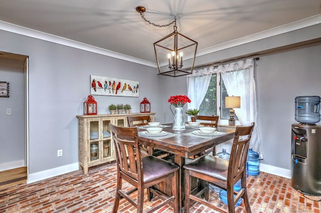 714 Popes Island Rd Unit 714, Milford, CT 06461 - dining space with baseboards, brick floors, ornamental molding, and a chandelier