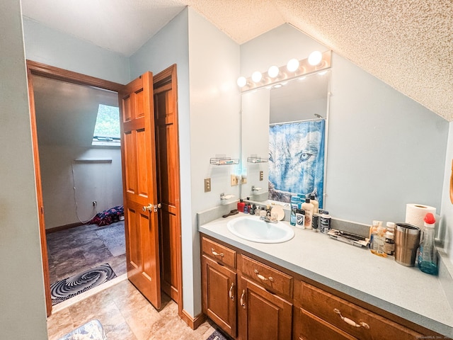 523 Wauregan Rd, Killingly, CT 06239 - bathroom featuring vanity, a textured ceiling, and a shower with shower curtain