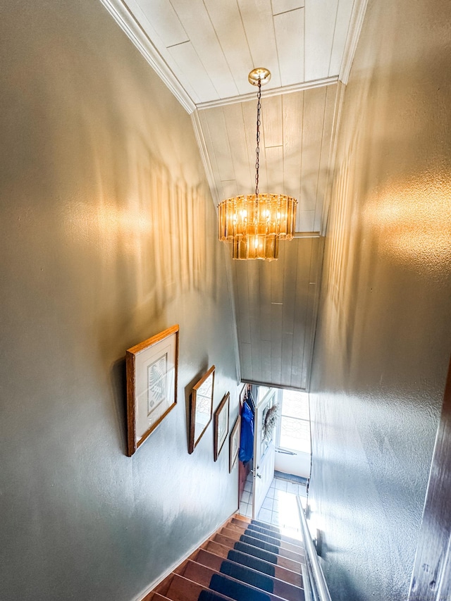 523 Wauregan Rd, Killingly, CT 06239 - stairs with crown molding, a chandelier, and wood finished floors