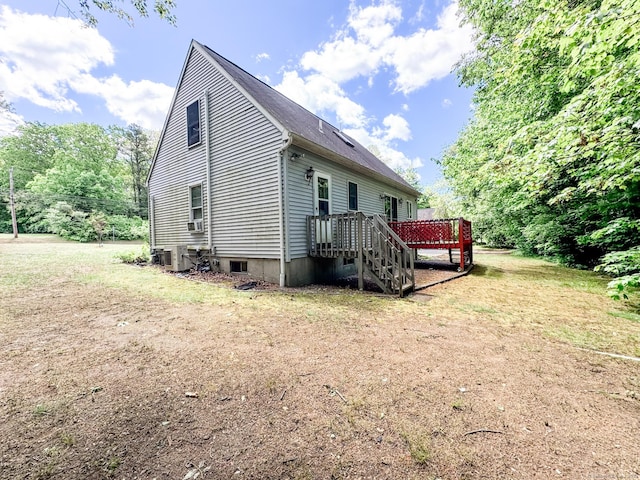 523 Wauregan Rd, Killingly, CT 06239 - view of side of home with a deck, central AC, cooling unit, and roof with shingles