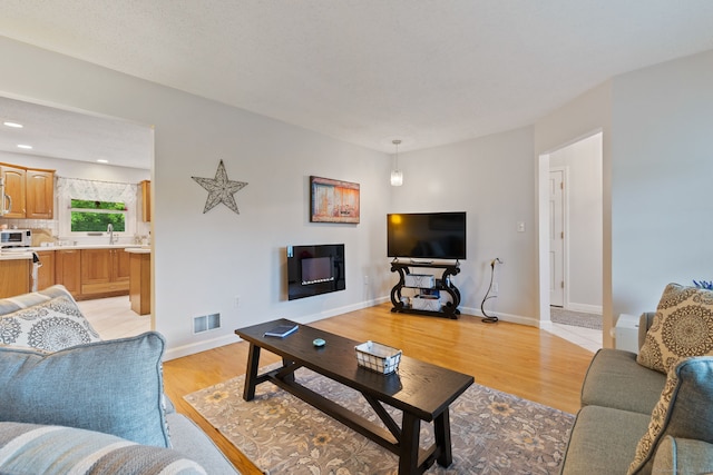 19 Ridgeview Dr, Ellington, CT 06029 - living room featuring light wood-style flooring and baseboards