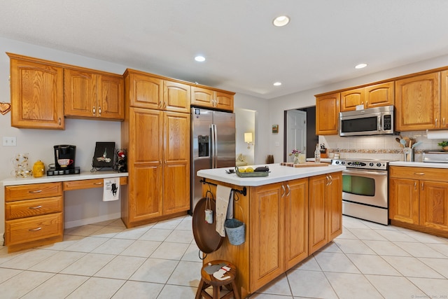19 Ridgeview Dr, Ellington, CT 06029 - kitchen featuring appliances with stainless steel finishes, light countertops, light tile patterned flooring, recessed lighting, and decorative backsplash