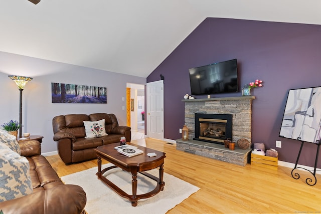 19 Ridgeview Dr, Ellington, CT 06029 - living room with wood finished floors, a stone fireplace, high vaulted ceiling, and baseboards