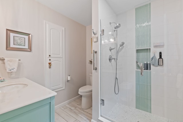 19 Ridgeview Dr, Ellington, CT 06029 - bathroom featuring a stall shower, toilet, baseboards, and vanity