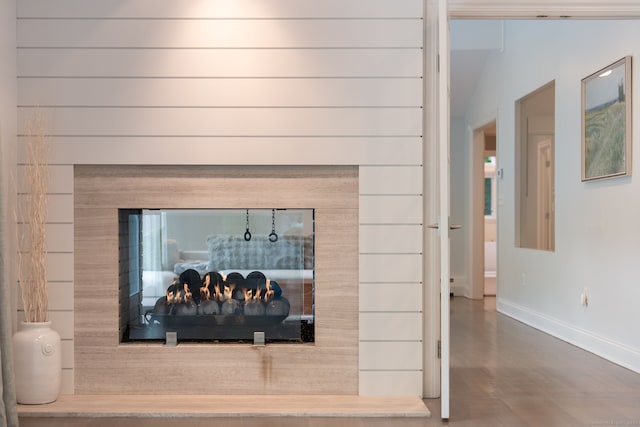 50 Parish Rd N, New Canaan, CT 06840 - detailed view of baseboards and a warm lit fireplace