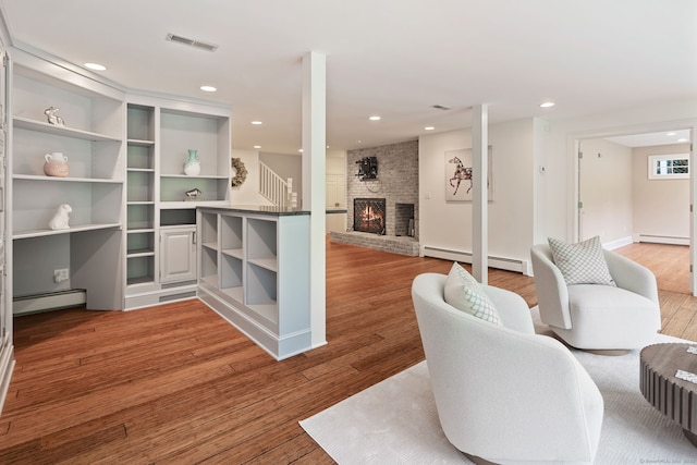 50 Parish Rd N, New Canaan, CT 06840 - living area with baseboard heating, light wood-style flooring, a baseboard radiator, and recessed lighting