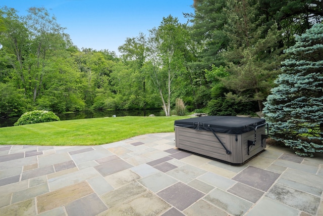 50 Parish Rd N, New Canaan, CT 06840 - view of patio with a hot tub and a forest view