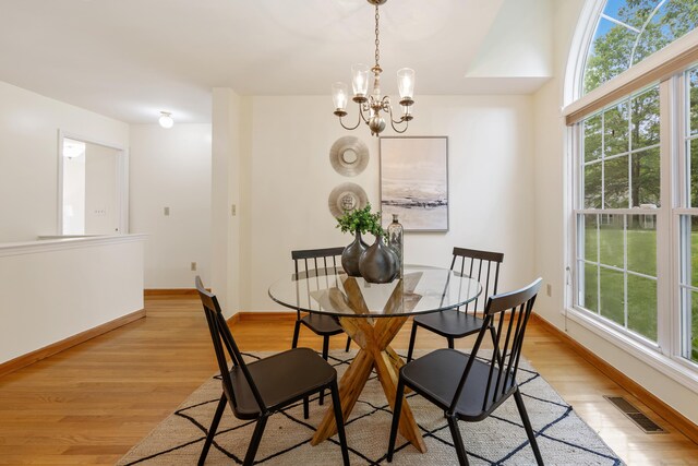 25 Hamden Hills Dr Unit 60, Hamden, CT 06518 - dining room featuring light wood-type flooring, a chandelier, and baseboards