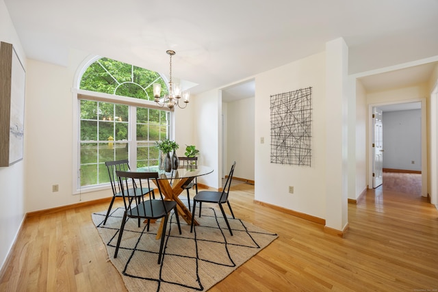 25 Hamden Hills Dr Unit 60, Hamden, CT 06518 - dining space with light wood-style floors, baseboards, and a chandelier