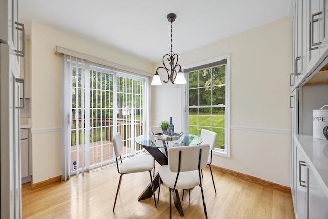 25 Hamden Hills Dr Unit 60, Hamden, CT 06518 - dining room with a chandelier, baseboards, plenty of natural light, and light wood-style flooring