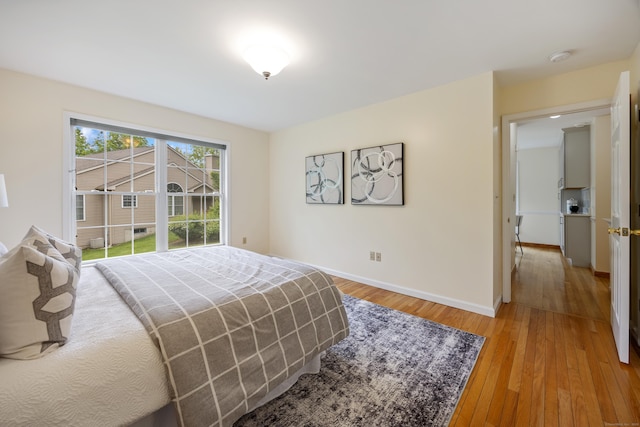 25 Hamden Hills Dr Unit 60, Hamden, CT 06518 - bedroom with baseboards and light wood-type flooring
