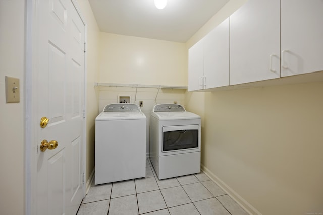 25 Hamden Hills Dr Unit 60, Hamden, CT 06518 - laundry room with washing machine and dryer, cabinet space, light tile patterned floors, and baseboards