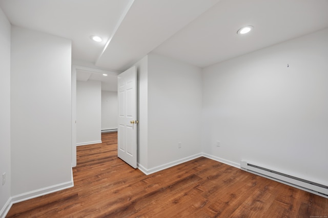 25 Hamden Hills Dr Unit 60, Hamden, CT 06518 - empty room with a baseboard radiator, wood finished floors, baseboards, and recessed lighting