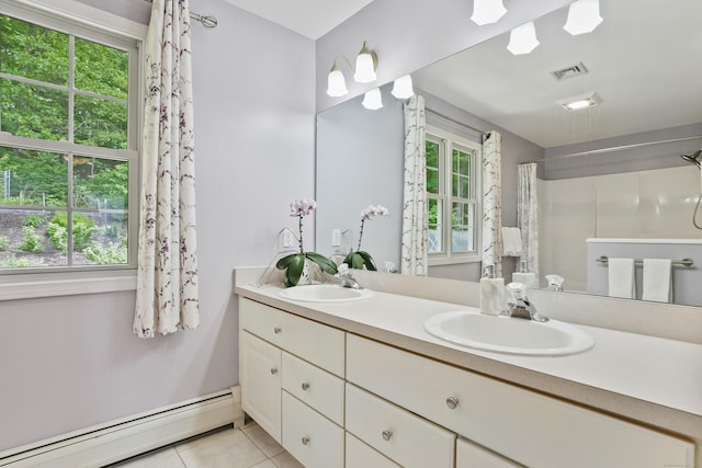 22 Gelding Hill Rd, Newtown, CT 06482 - full bath with a baseboard heating unit, double vanity, tile patterned flooring, and healthy amount of natural light