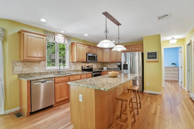 22 Gelding Hill Rd, Newtown, CT 06482 - kitchen featuring appliances with stainless steel finishes, a sink, light wood finished floors, backsplash, and recessed lighting