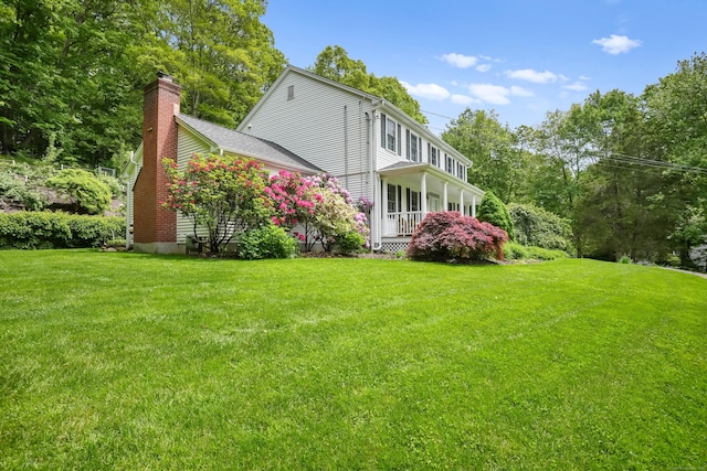 22 Gelding Hill Rd, Newtown, CT 06482 - view of side of property with a chimney and a lawn