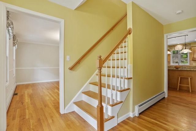 22 Gelding Hill Rd, Newtown, CT 06482 - stairs featuring baseboard heating, wood finished floors, baseboards, and a baseboard radiator