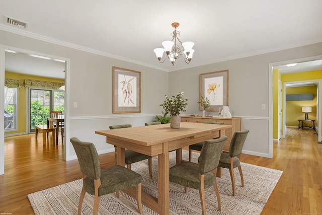 22 Gelding Hill Rd, Newtown, CT 06482 - dining room featuring a chandelier, light wood finished floors, baseboards, and ornamental molding