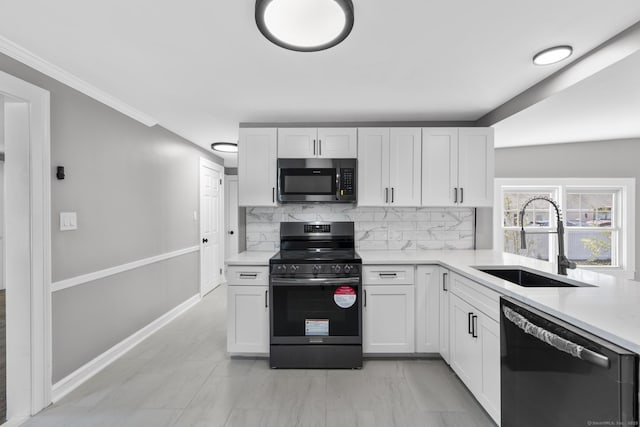 330 Meriden Ave, Southington, CT 06489 - kitchen featuring stainless steel appliances, a sink, decorative backsplash, light countertops, and white cabinets