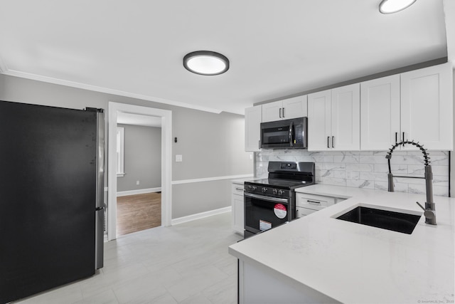 330 Meriden Ave, Southington, CT 06489 - kitchen featuring stainless steel appliances, a sink, light countertops, decorative backsplash, and white cabinets