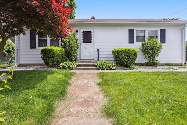64 Willow St, Milford, CT 06460 - view of front facade with a front yard