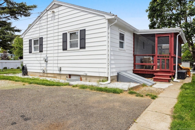 64 Willow St, Milford, CT 06460 - view of side of property featuring a sunroom