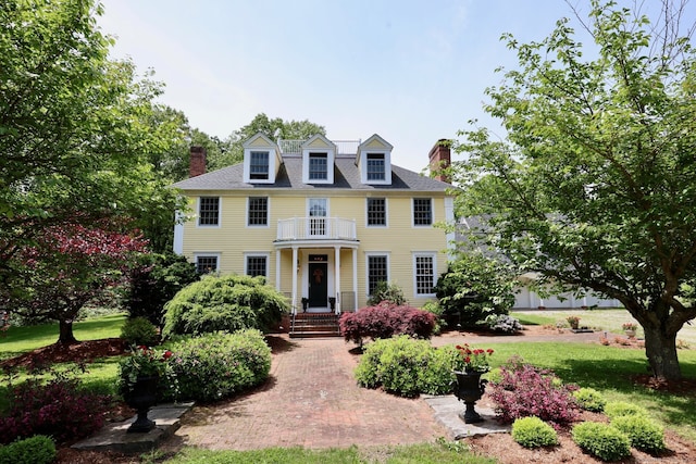 52 Dug Rd, Glastonbury, CT 06073 - colonial inspired home with a balcony, a chimney, and a front yard