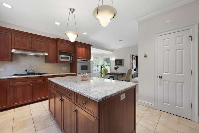 52 Dug Rd, Glastonbury, CT 06073 - kitchen featuring under cabinet range hood, stainless steel appliances, light tile patterned floors, crown molding, and decorative light fixtures