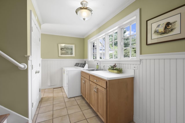 52 Dug Rd, Glastonbury, CT 06073 - laundry room with cabinet space, independent washer and dryer, wainscoting, crown molding, and light tile patterned floors
