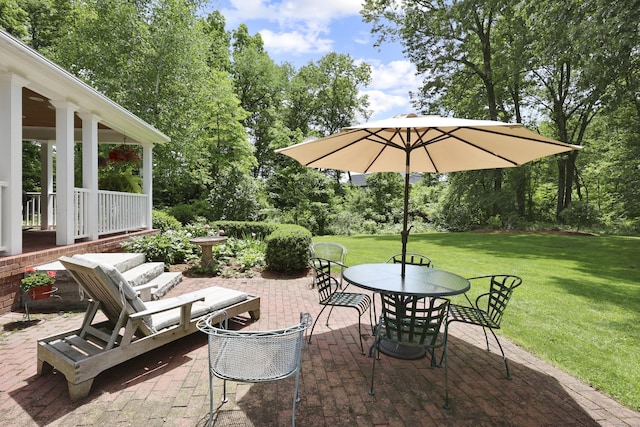 52 Dug Rd, Glastonbury, CT 06073 - view of patio with outdoor dining space and view of scattered trees