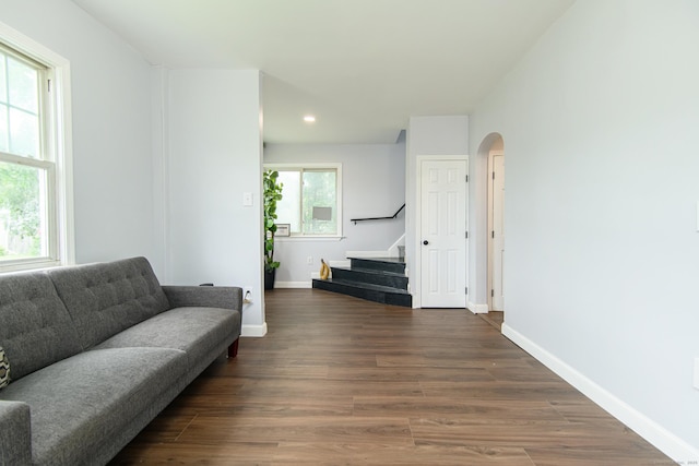 163 State Ave, Killingly, CT 06241 - living room featuring arched walkways, stairs, wood finished floors, and recessed lighting
