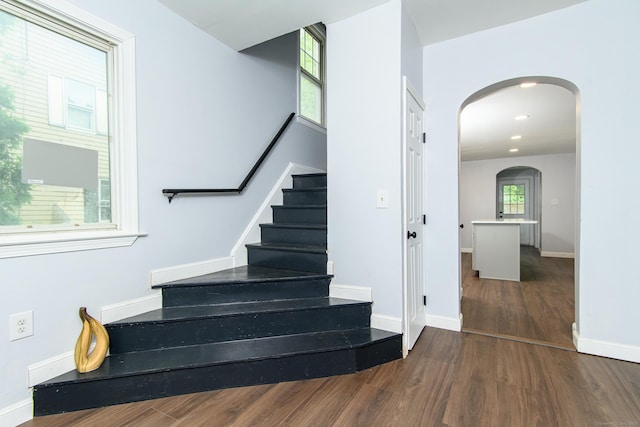 163 State Ave, Killingly, CT 06241 - stairway featuring arched walkways, wood finished floors, and recessed lighting