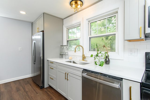 163 State Ave, Killingly, CT 06241 - kitchen featuring appliances with stainless steel finishes, backsplash, dark wood-style flooring, light countertops, and recessed lighting