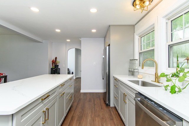 163 State Ave, Killingly, CT 06241 - kitchen featuring appliances with stainless steel finishes, gray cabinets, arched walkways, recessed lighting, and dark wood-style flooring