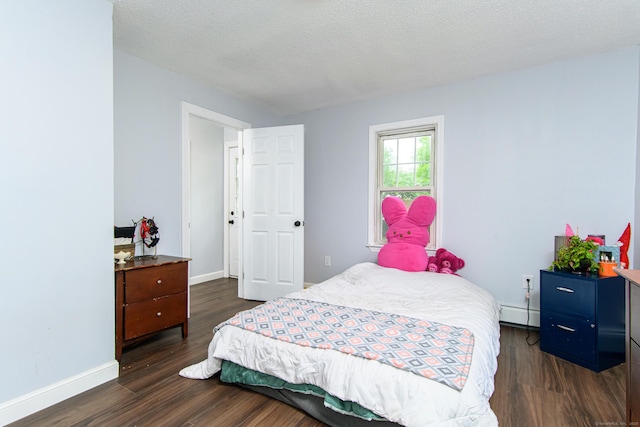 163 State Ave, Killingly, CT 06241 - bedroom featuring dark wood-style flooring and a baseboard radiator