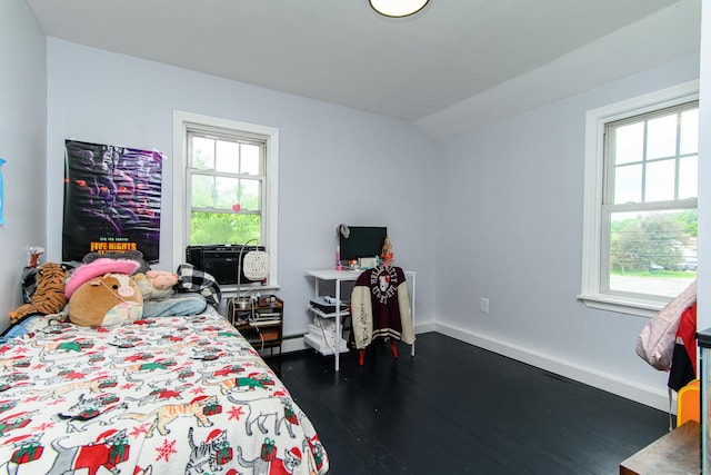 163 State Ave, Killingly, CT 06241 - bedroom with multiple windows, dark wood-style floors, and a baseboard heating unit