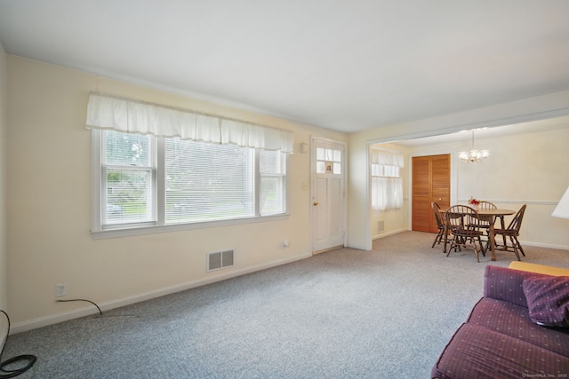 19 Litchfield Pl, Rocky Hill, CT 06067 - living area with healthy amount of natural light, carpet flooring, and a chandelier