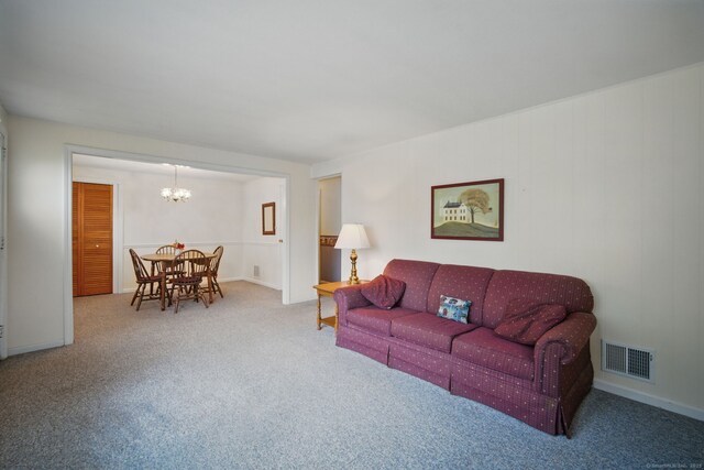 19 Litchfield Pl, Rocky Hill, CT 06067 - carpeted living room with a chandelier