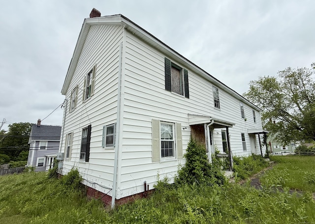 37 Aldrich Ave, Plainfield, CT 06354 - rear view of house with a chimney