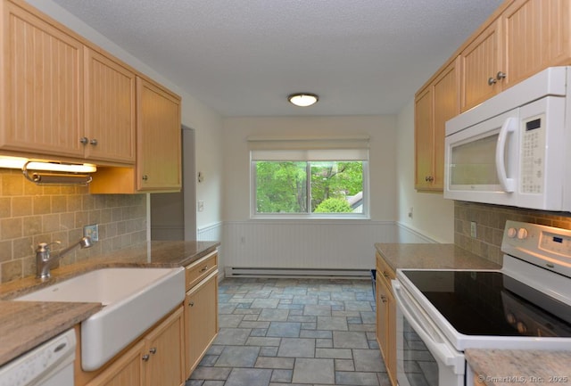 881 Heritage Vlg Unit B, Southbury, CT 06488 - kitchen with white appliances, a sink, wainscoting, stone finish floors, and light brown cabinets