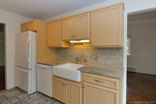 881 Heritage Vlg Unit B, Southbury, CT 06488 - kitchen with white appliances, a sink, light brown cabinetry, baseboard heating, and backsplash