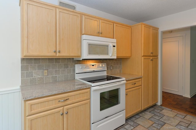 881 Heritage Vlg Unit B, Southbury, CT 06488 - kitchen featuring white appliances, light brown cabinets, backsplash, and wainscoting