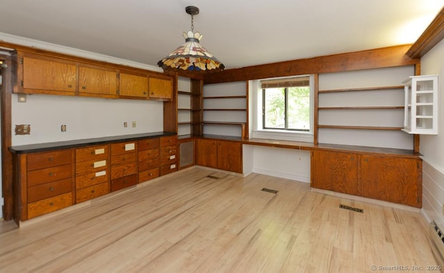 881 Heritage Vlg Unit B, Southbury, CT 06488 - kitchen with open shelves, brown cabinets, light wood finished floors, and dark countertops