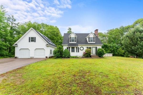 5 Conrad Ct, Ledyard, CT 06335 - cape cod-style house with a chimney, a detached garage, and a front yard