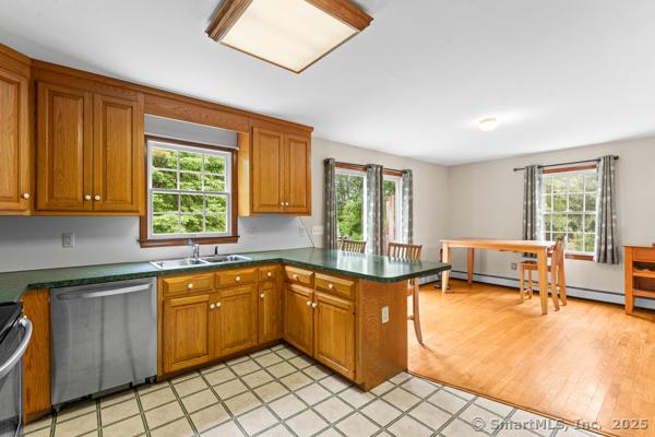 5 Conrad Ct, Ledyard, CT 06335 - kitchen with stainless steel appliances, a peninsula, and plenty of natural light