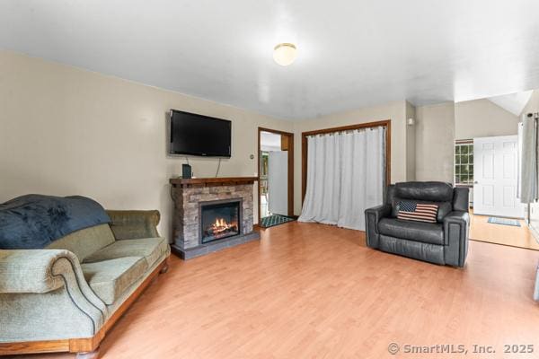 5 Conrad Ct, Ledyard, CT 06335 - living area featuring wood finished floors and a stone fireplace
