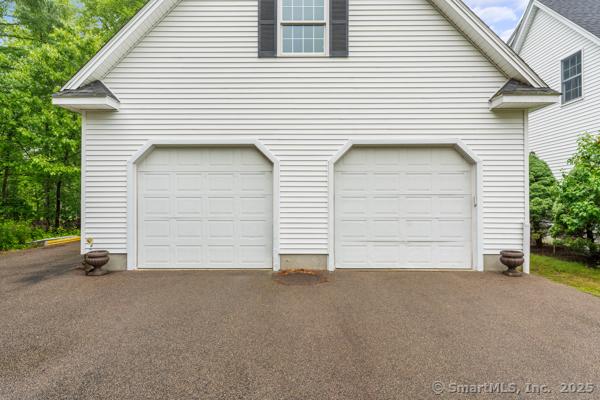 5 Conrad Ct, Ledyard, CT 06335 - garage with asphalt driveway