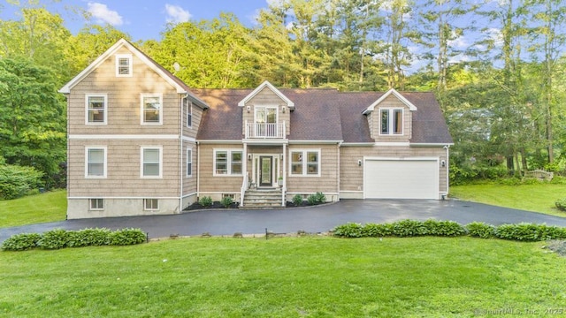 308 Old Zoar Rd, Monroe, CT 06468 - view of front of house with a balcony, driveway, a front lawn, a garage, and view of wooded area
